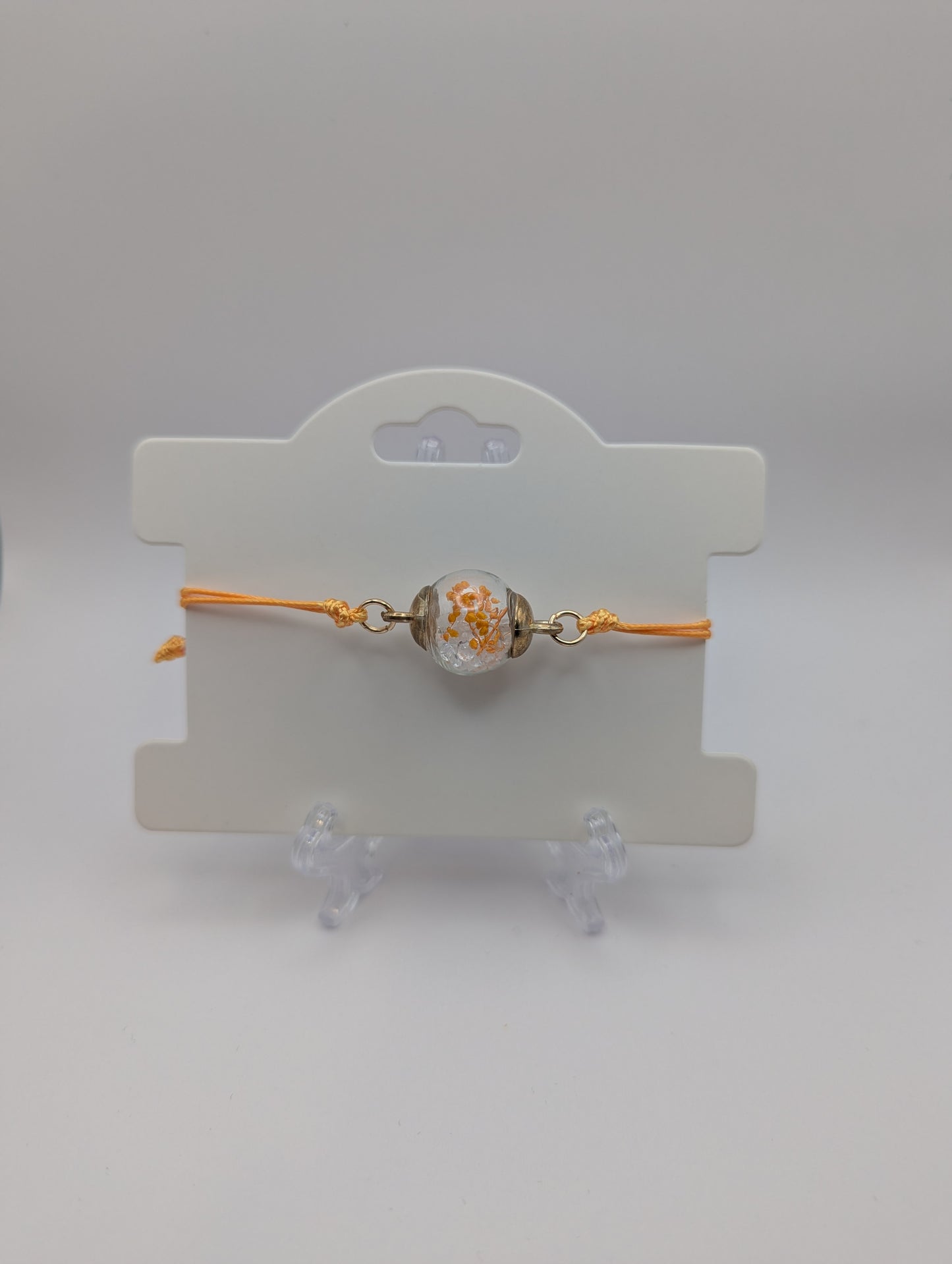 Orange Flower & Clear Rhinestone Globe Bracelet on Orange Cord