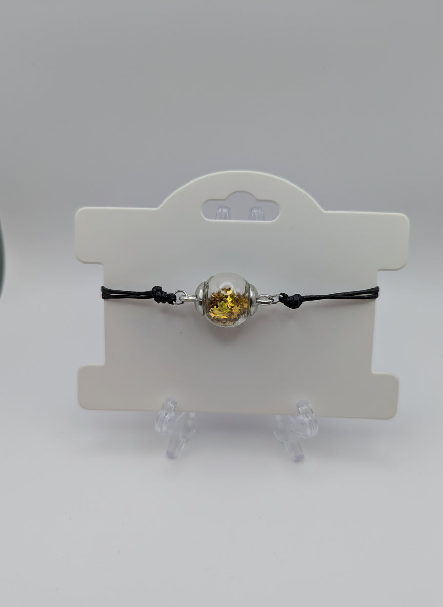 Gold Star Glitter Globe Bracelet on Adjustable Black Cord