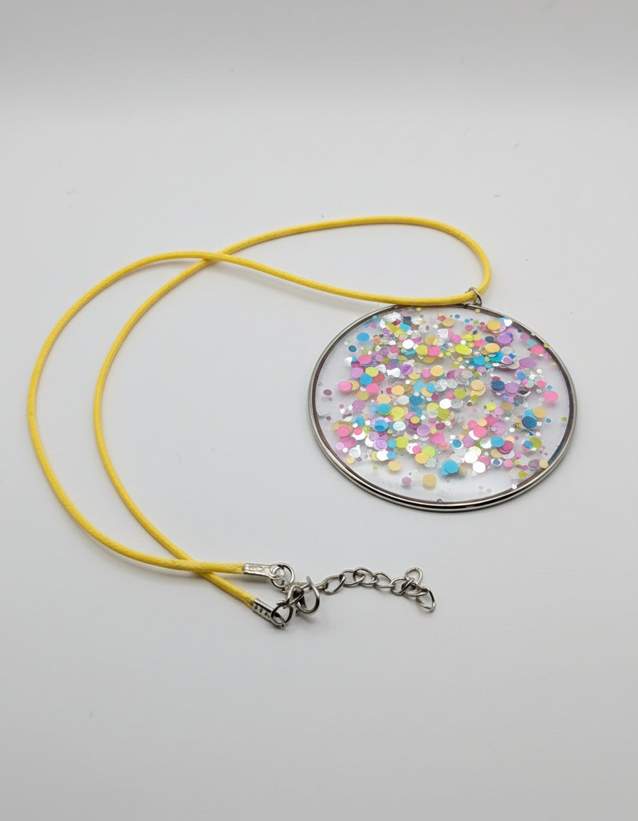 Multidimensional Neon Glitter Resin Pendant on Yellow Nylon Cord