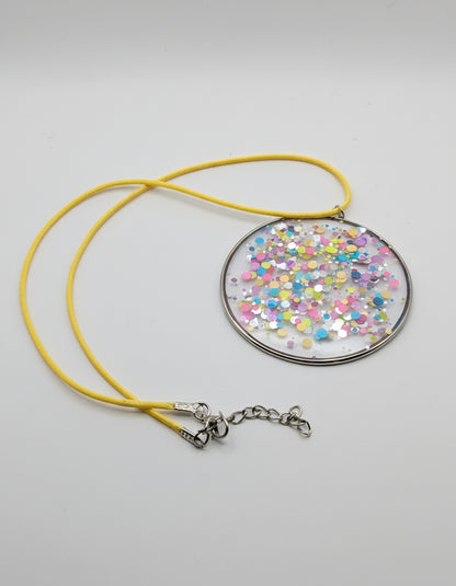 Multidimensional Neon Glitter Resin Pendant on Yellow Nylon Cord