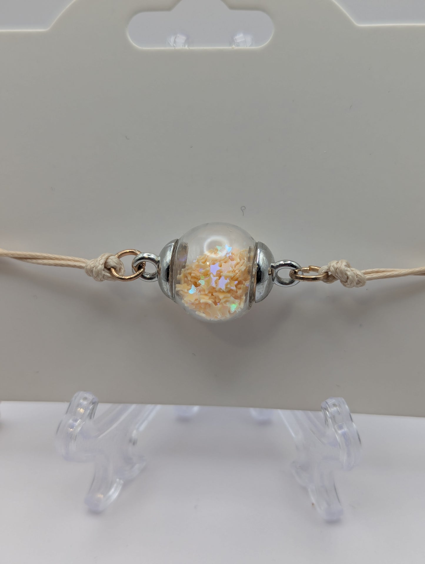Cream Star Glitter Globe Bracelet on Adjustable Nylon Cord