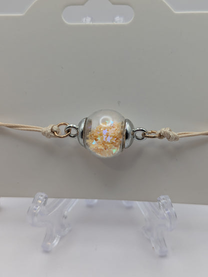 Cream Star Glitter Globe Bracelet on Adjustable Nylon Cord
