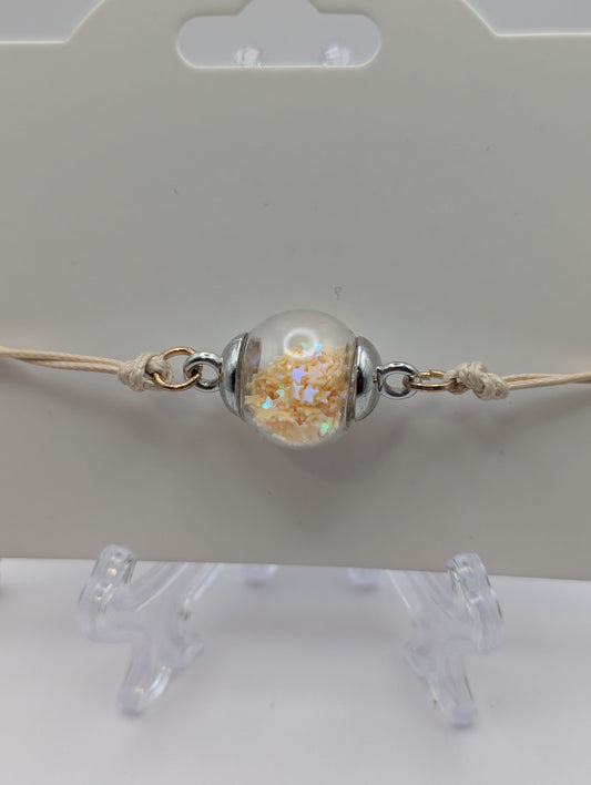 Cream Star Glitter Globe Bracelet on Adjustable Nylon Cord