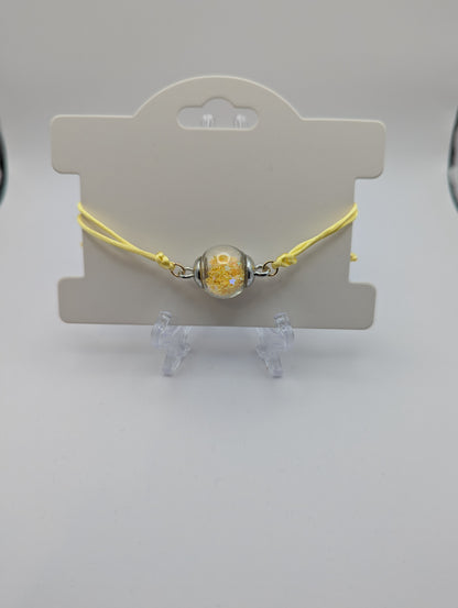 Yellow Star Glitter Globe Bracelet on Adjustable Nylon Cord