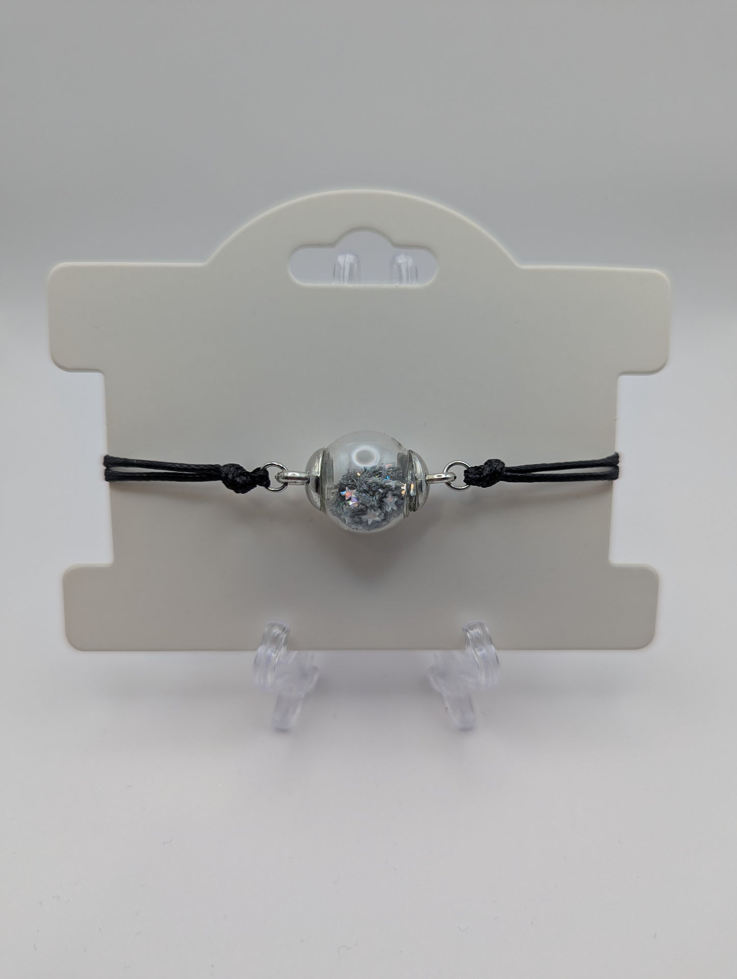 Silver Star Glitter Globe Bracelet on Adjustable Black Nylon Cord