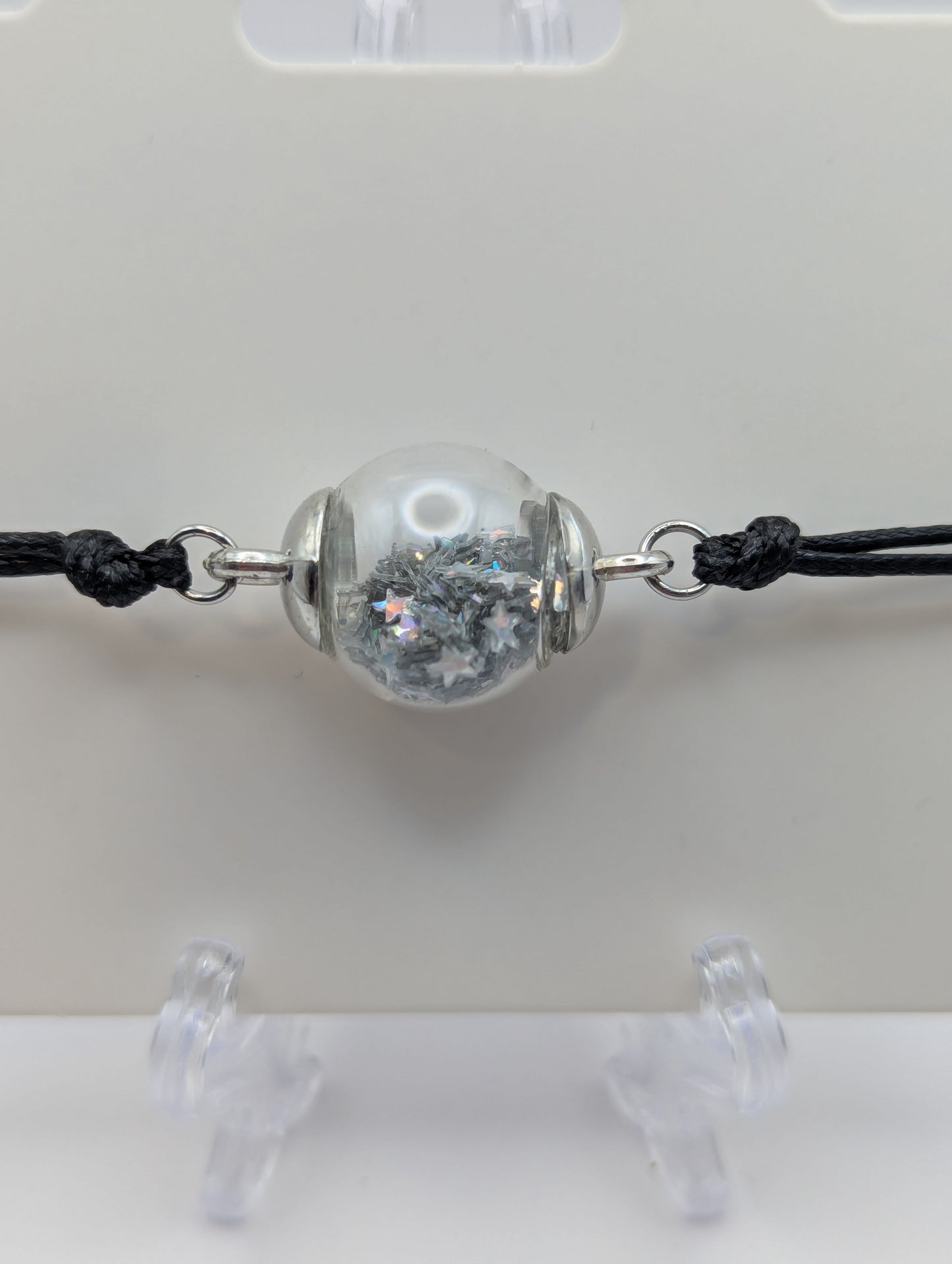 Silver Star Glitter Globe Bracelet on Adjustable Black Nylon Cord
