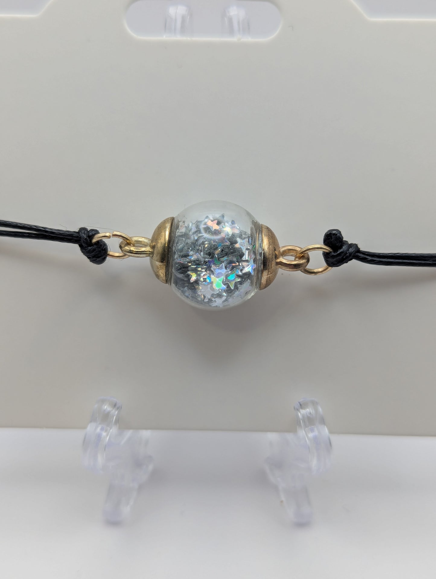 Silver Star Glitter Globe Bracelet on Adjustable Black Nylon Cord