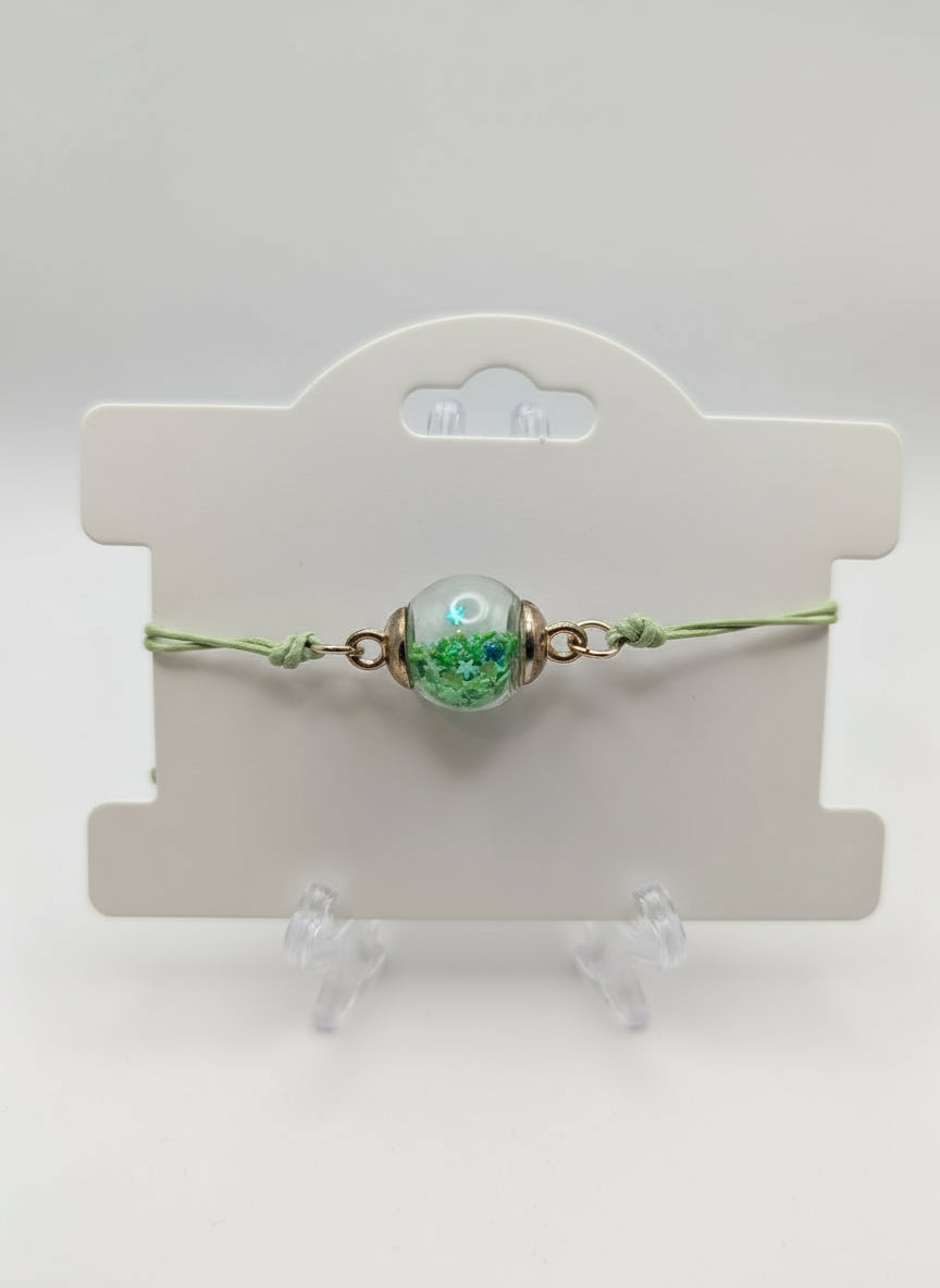 Green Petal & Crystal Glitter Globe Bracelet on Green Cord