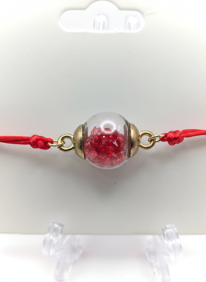 Red Rhinestone Globe Bracelet on Red Cord