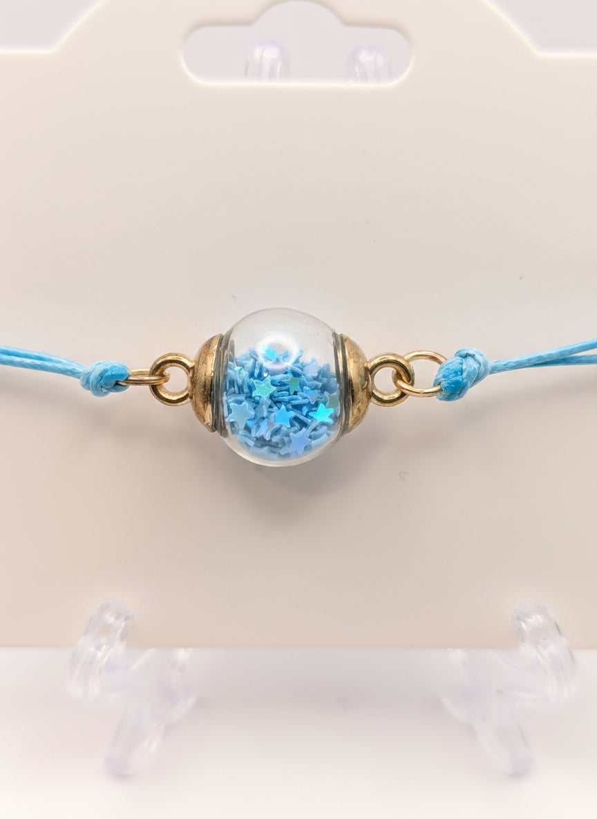 Sky Blue Glitter Globe Bracelet on Adjustable Cord