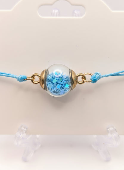 Sky Blue Glitter Globe Bracelet on Adjustable Cord