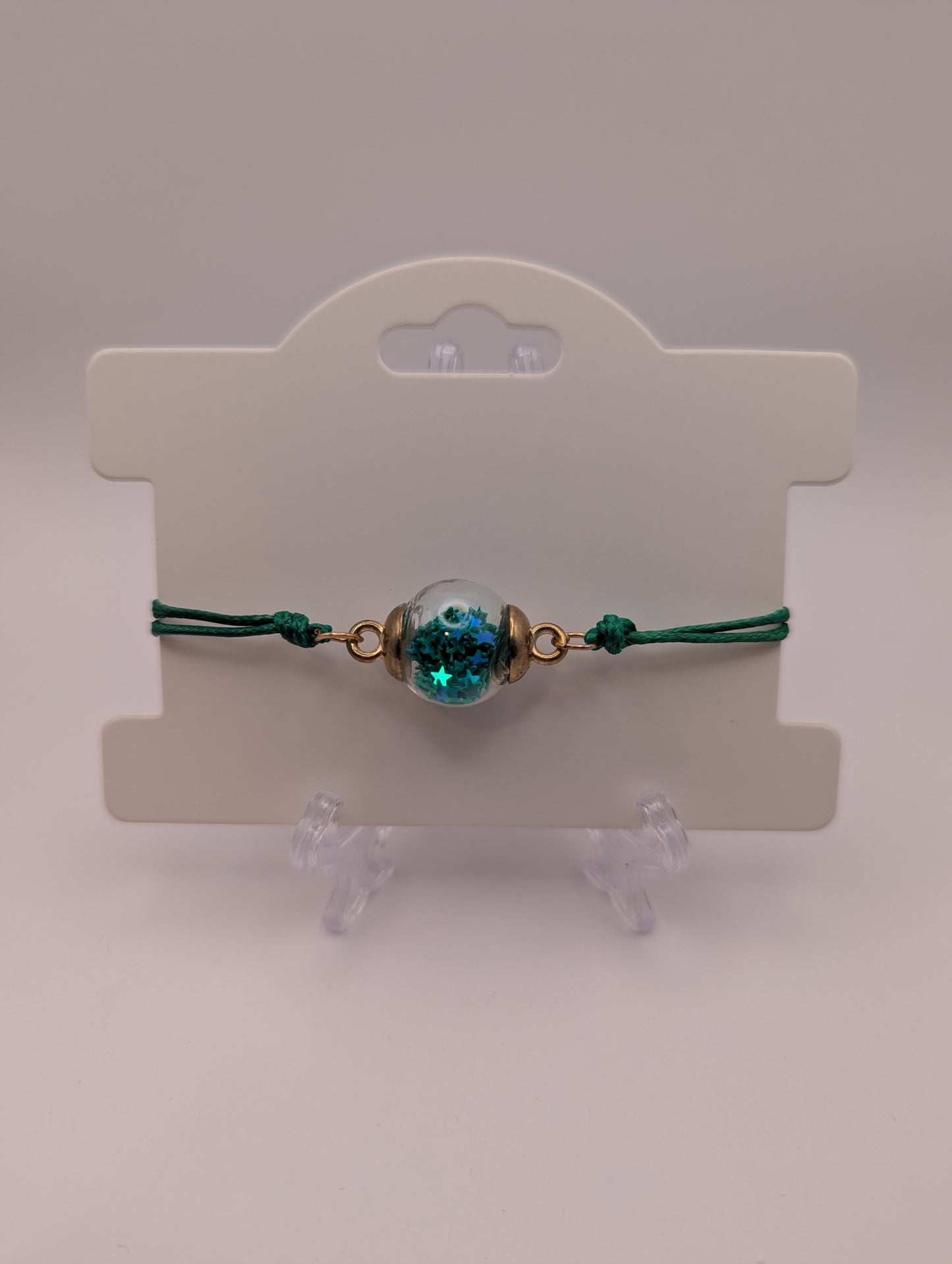 Dark Teal Star Glitter Globe Bracelet on Green Cord