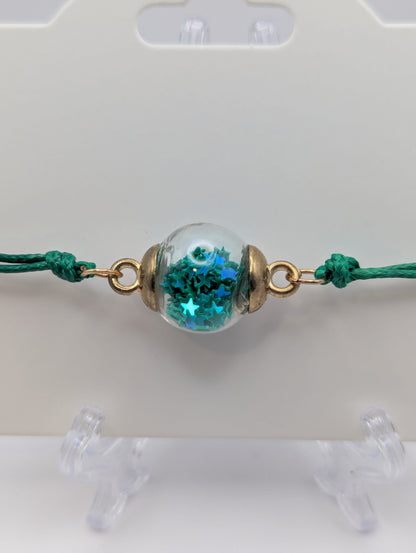 Dark Teal Star Glitter Globe Bracelet on Green Cord