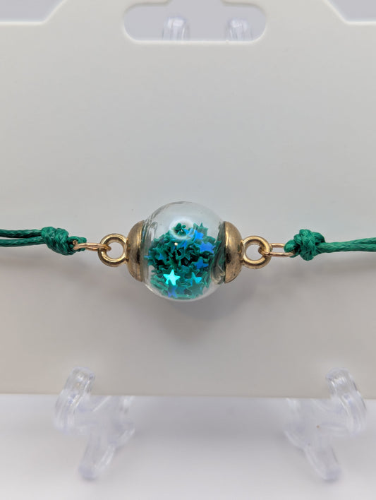 Dark Teal Star Glitter Globe Bracelet on Green Cord