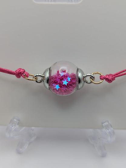 Fuchsia Glitter Globe Bracelet on Adjustable Cord