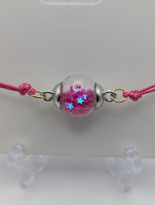 Fuchsia Glitter Globe Bracelet on Adjustable Cord