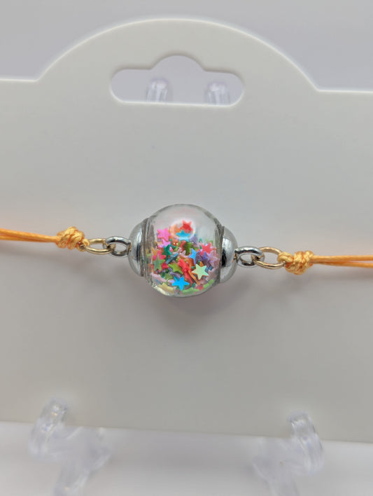 Multicolor Star Glitter Globe Bracelet on Adjustable Yellow Nylon Cord