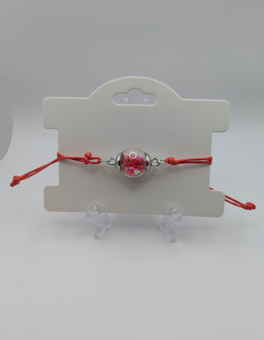 Red Star Glitter Globe Bracelet on Adjustable Red Cord
