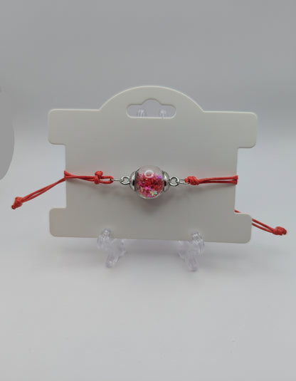 Red Star Glitter Globe Bracelet on Adjustable Red Cord