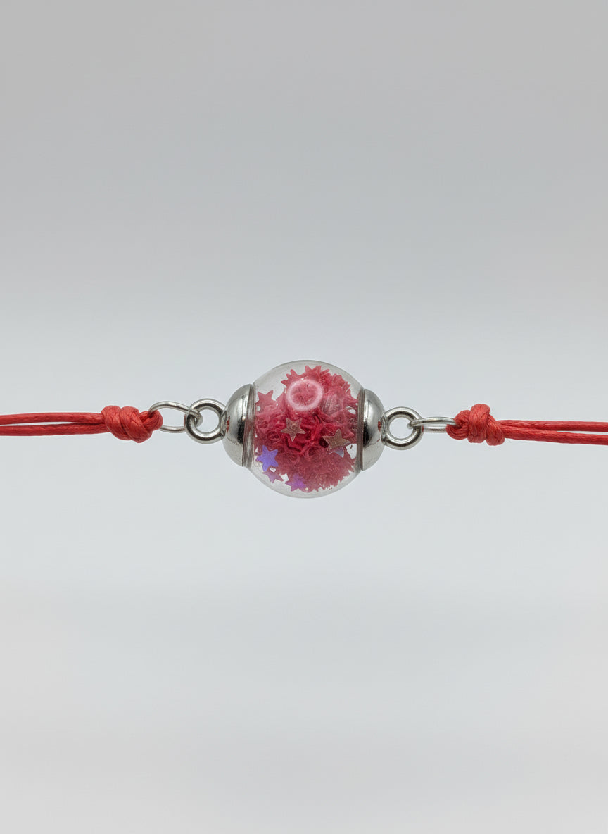 Red Star Glitter Globe Bracelet on Adjustable Red Cord