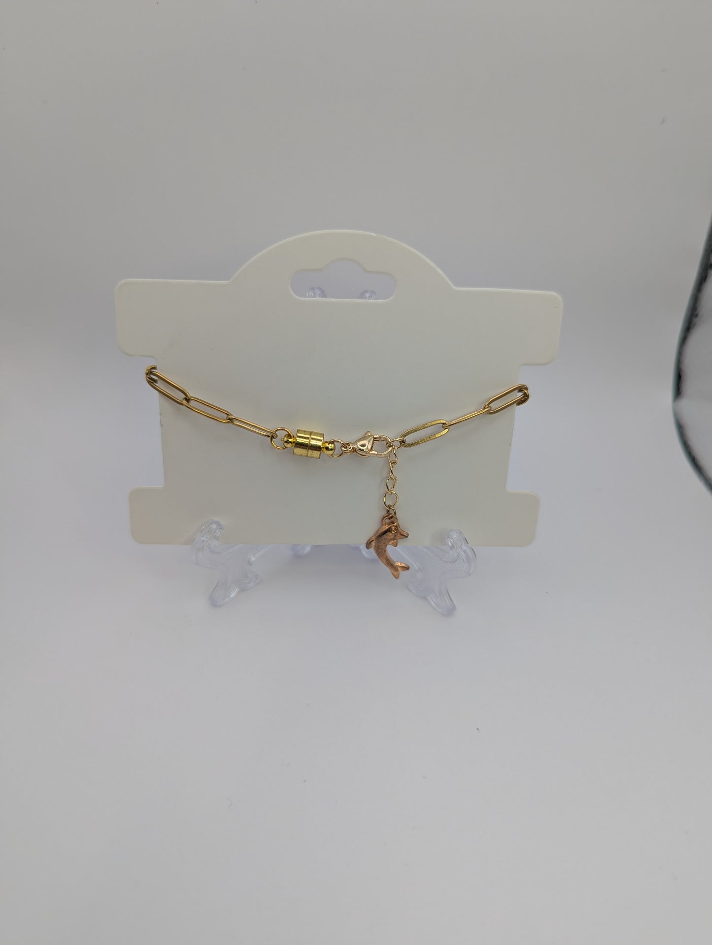 Aquamarine Rhinestone Globe on Gold Paperclip Bracelet With Dolphin Accent