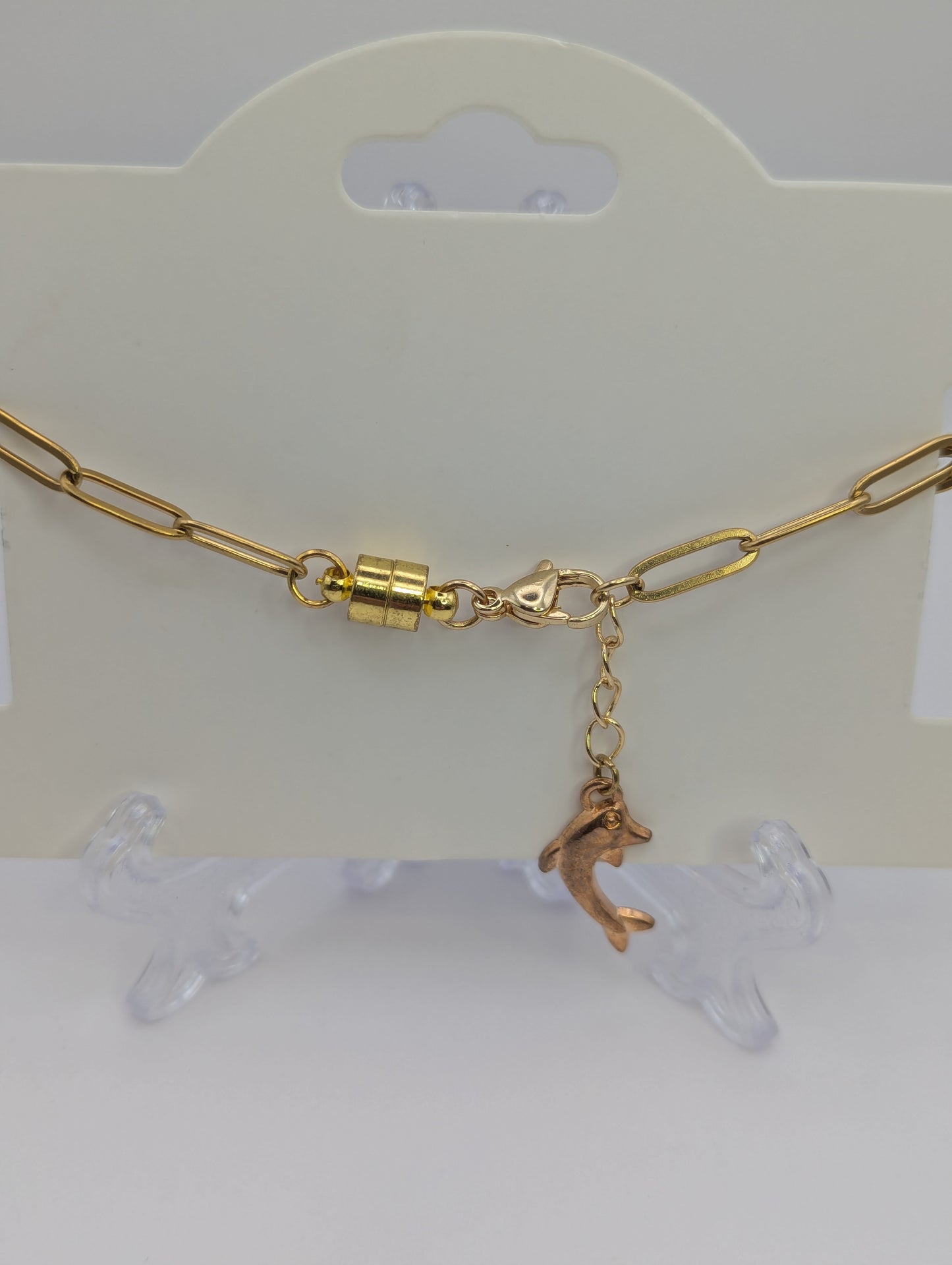 Aquamarine Rhinestone Globe on Gold Paperclip Bracelet With Dolphin Accent