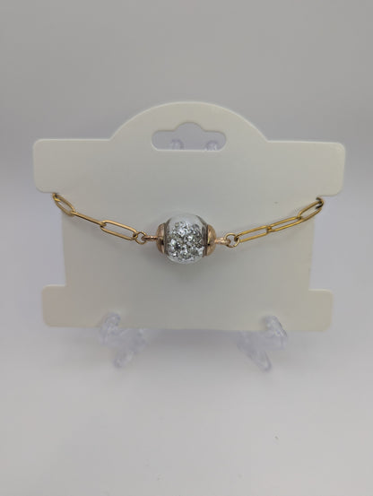 Silver Stone Flecks In Globe on Gold Paperclip Chain Bracelet