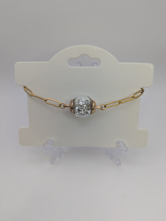 Silver Stone Flecks In Globe on Gold Paperclip Chain Bracelet