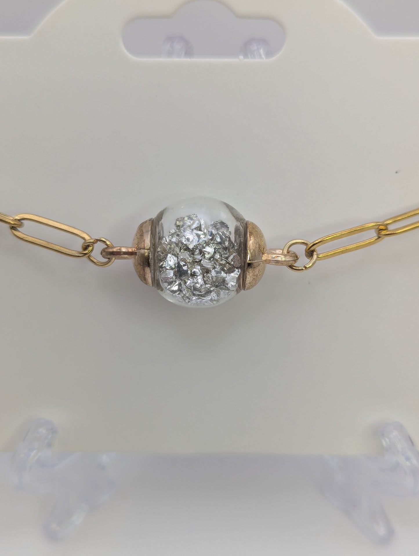 Silver Stone Flecks In Globe on Gold Paperclip Chain Bracelet