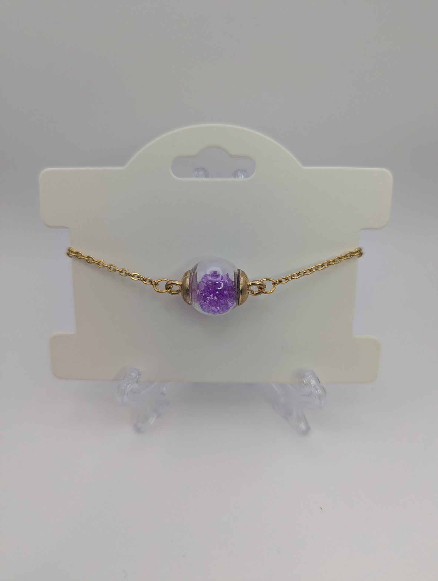 Violet Rhinestones in Glass Globe on Gold Bracelet