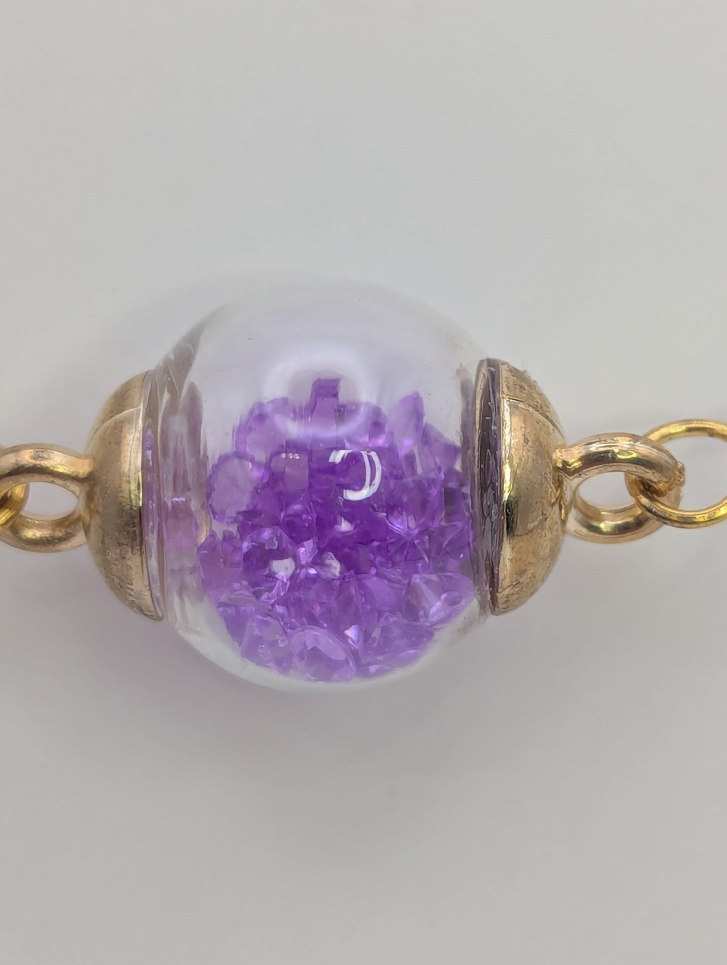 Violet Rhinestones in Glass Globe on Gold Bracelet