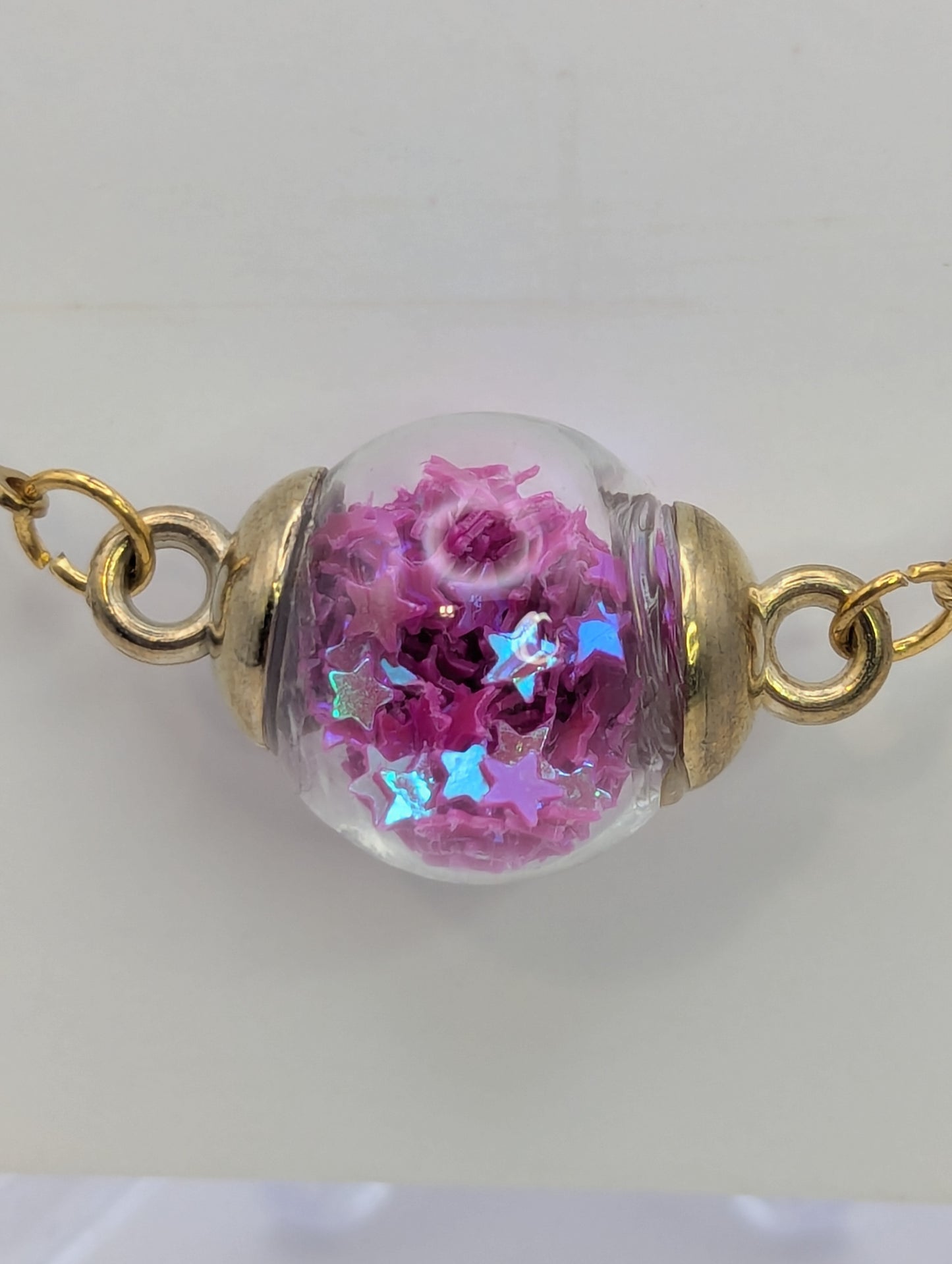 Fuchsia Glitter Globe Bracelet on Gold Chain
