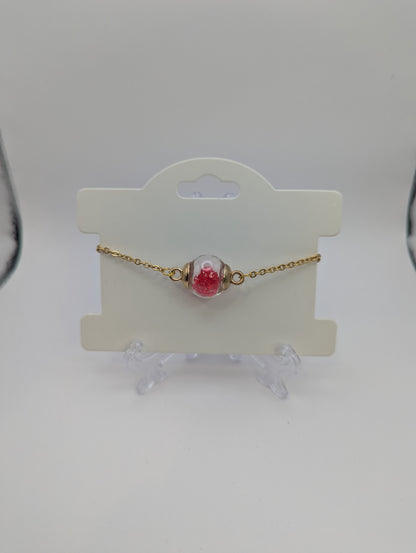 Red Rhinestones in Glass Globe on Gold Bracelet