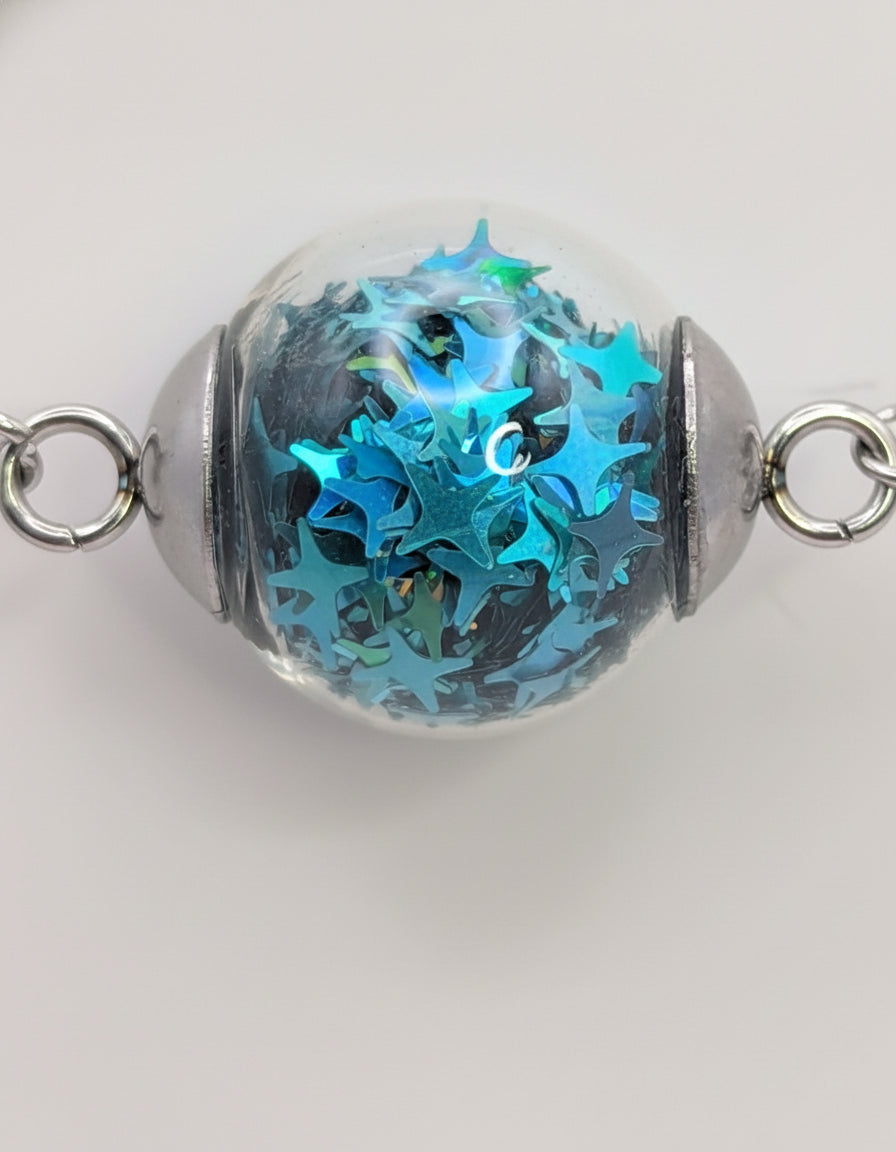 Aquamarine Star Glitter Globe on Adjustable Silver Chain Bracelet